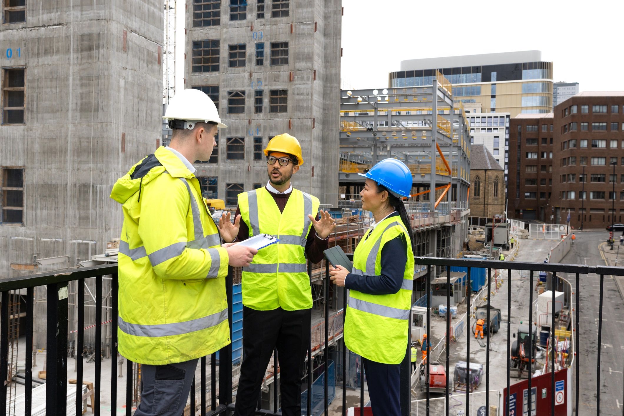 G.A Building Services team discussing a construction project on site